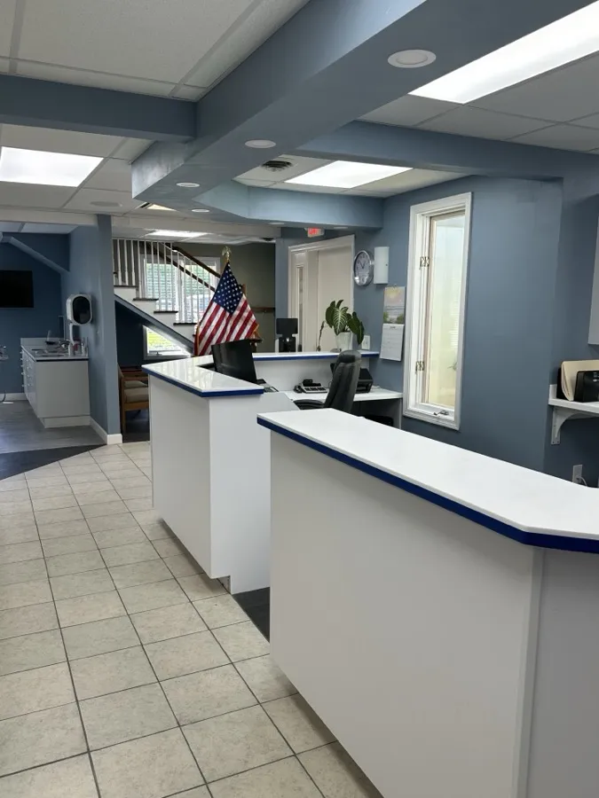 Check-out desk with framed dental degrees